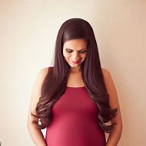 A pregnant woman with long brown hair